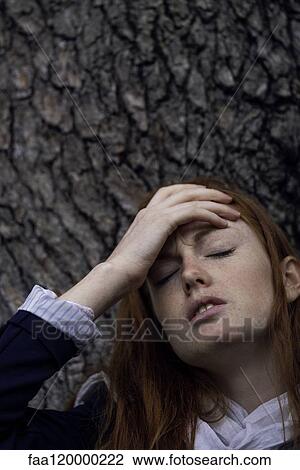 Woman having headache View Large Photo Image Stock Image - Woman having headache. Fotosearch