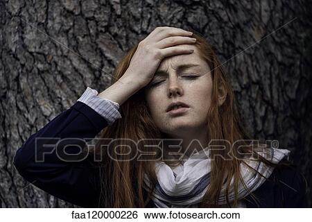 Woman having headache View Large Photo Image Stock Photograph - Woman having headache. Fotosearch