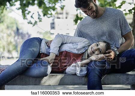 Woman relaxing on the man's lap View Large Photo Image Stock Image - Woman relaxing on the man's lap. Fotosearch