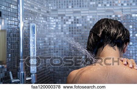 Woman taking shower View Large Photo Image Stock Photo - Woman taking shower. Fotosearch