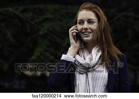 Woman talking on smart phone View Large Photo Image Picture - Woman talking on smart phone. Fotosearch