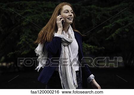 Woman talking on smart phone View Large Photo Image Stock Photograph - Woman talking on smart phone. Fotosearch