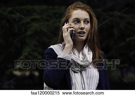 Woman talking on smart phone View Large Photo Image Stock Photography - Woman talking on smart phone. Fotosearch