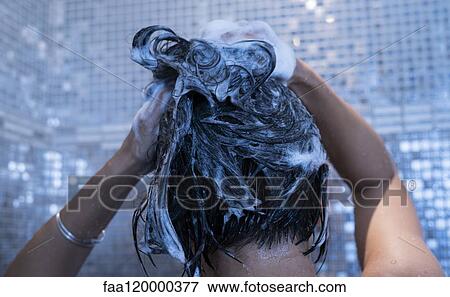 Woman washing her hair View Large Photo Image Stock Photo - Woman washing her hair. Fotosearch