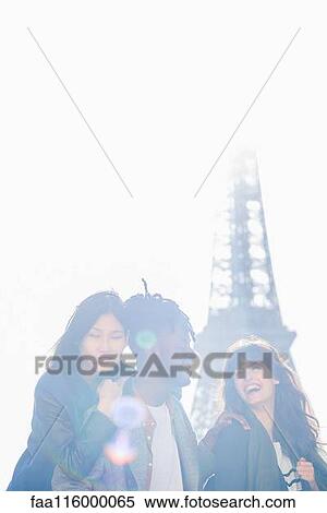 Stock Photography - Young friends standing together. Fotosearch
