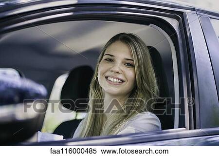 Young woman in car View Large Photo Image Stock Photography - Young woman in car. Fotosearch