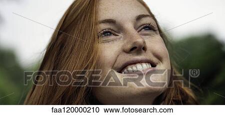 Young woman smiling View Large Photo Image Stock Image - Young woman smiling. Fotosearch