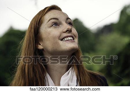 Young woman smiling View Large Photo Image Stock Image - Young woman smiling. Fotosearch