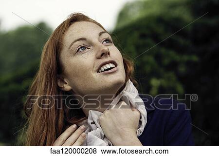 Young woman smiling View Large Photo Image Stock Photo - Young woman smiling. Fotosearch