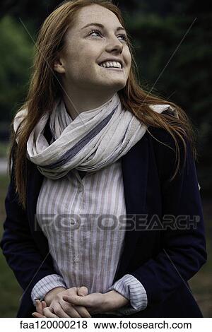 Young woman smiling View Large Photo Image Stock Photo - Young woman smiling. Fotosearch