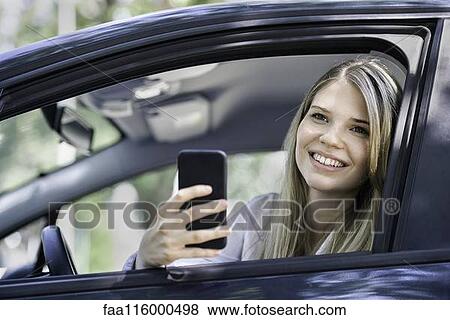 Young woman taking photograph View Large Photo Image Stock Photo - Young woman taking photograph. Fotosearch