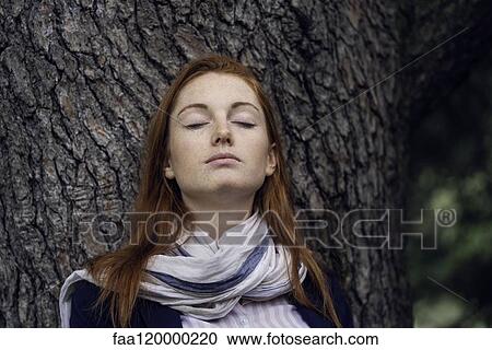 Young woman with eyes closed View Large Photo Image Stock Image - Young woman with eyes closed. Fotosearch