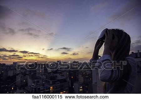 Stock Photography - Young woman with virtual reality headset. Fotosearch