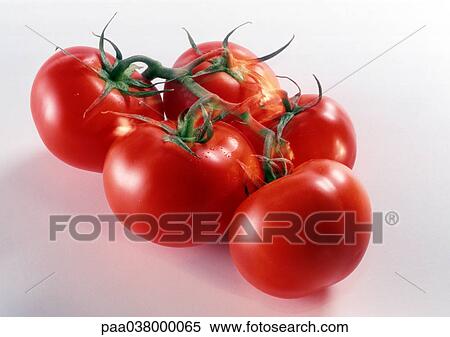 Stock Photography - Bunch of vine tomatoes, close up. Fotosearch