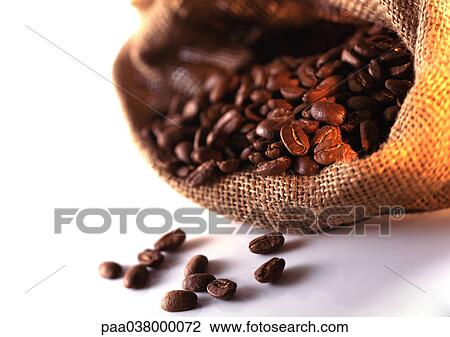 Stock Image - Coffee beans spilling out of burlap sack. Fotosearch