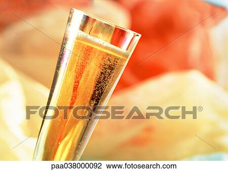 Stock Image - Flute of champagne, tilted, close-up. Fotosearch