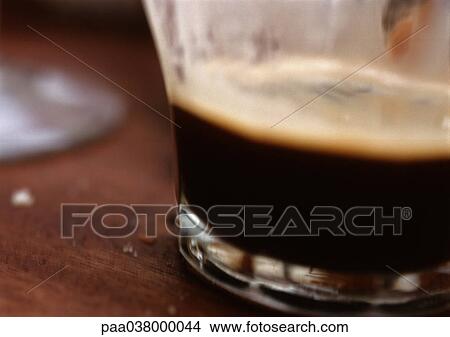 Picture - Half-full glass, close-up. Fotosearch