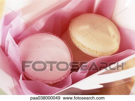 Macaroons in box with pink tissue paper, close-up View Large Photo Image Stock Photo - Macaroons in box with pink tissue paper, close-up. Fotosearch