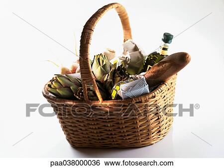 Stock Photograph - Market basket containing bread, artichokes, and bottle. Fotosearch