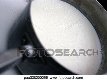 Milk in saucepan, close-up View Large Photo Image Stock Photograph - Milk in saucepan, close-up. Fotosearch