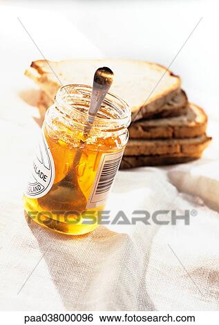 Stock Photograph - Slices of toast and jar of marmalade. Fotosearch