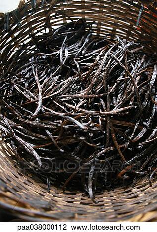 Stock Image - Vanilla pods in basket. Fotosearch