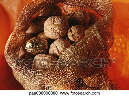 Stock Image - Walnuts in burlap sack. Fotosearch