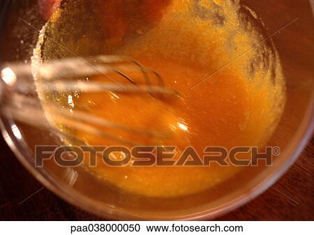 Whisk beating egg yolks in bowl, close-up View Large Photo Image Stock Image - Whisk beating egg yolks in bowl, close-up. Fotosearch