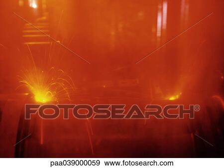 Stock Photo - Burst of sparks, blurred. Fotosearch
