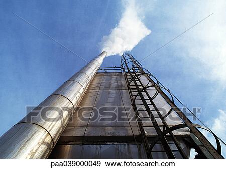 Stock Photo - Ladder and plant chimney, low angle view. Fotosearch