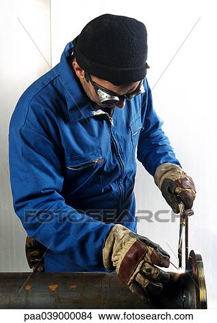 Man using welding torch View Large Photo Image Picture - Man using welding torch. Fotosearch