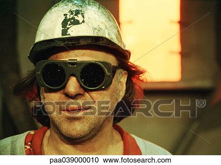 Man wearing hard hat and protective glasses, portrait View Large Photo Image Stock Image - Man wearing hard hat and protective glasses, portrait. Fotosearch