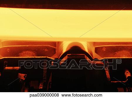 Stock Photo - Molten metal in rolling mill, close-up. Fotosearch