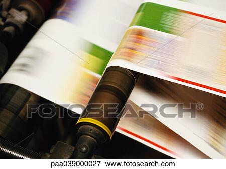 Stock Photo - Paper on printing press, close up, blurred motion. Fotosearch