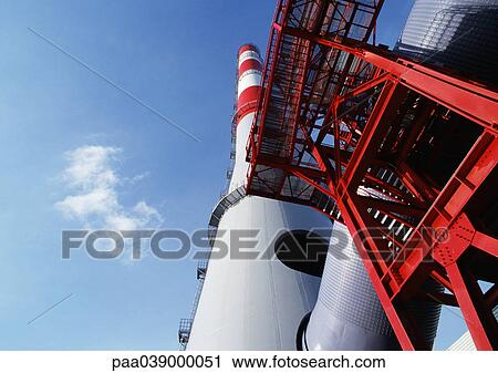 Plant chimney, low angle view View Large Photo Image Stock Image - Plant chimney, low angle view. Fotosearch
