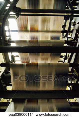 Printed newspaper on printing press, blurred motion View Large Photo Image Picture - Printed newspaper on printing press, blurred motion. Fotosearch