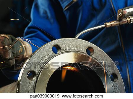 Stock Photo - Worker welding, close-up. Fotosearch