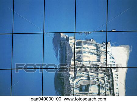 Stock Image - Building reflected in window panes. Fotosearch