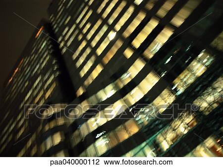 Skyscraper at night, low angle view View Large Photo Image Stock Image - Skyscraper at night, low angle view. Fotosearch