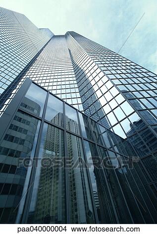 Picture - Skyscraper, building reflected in window panes, low angle view. Fotosearch