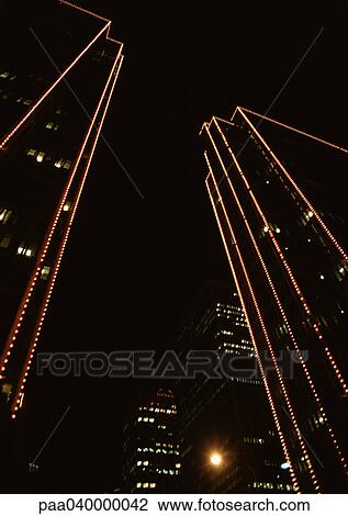 Skyscrapers at night, low angle view View Large Photo Image Stock Image - Skyscrapers at night, low angle view. Fotosearch