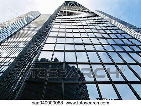 Skyscraper's facade, low angle view View Large Photo Image Stock Photo - Skyscraper's facade, low angle view. Fotosearch