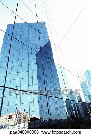 Stock Image - United States, New York, buildings reflected in window panes. Fotosearch
