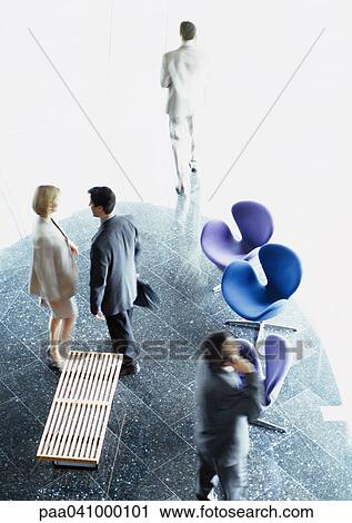 Business people standing in lobby, elevated view View Large Photo Image Stock Image - Business people standing in lobby, elevated view. Fotosearch