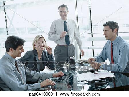 Four business people in conference room, blurred View Large Photo Image Stock Image - Four business people in conference room, blurred. Fotosearch