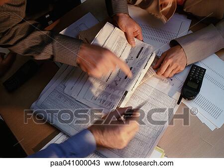 Hands pointing at documents View Large Photo Image Stock Image - Hands pointing at documents. Fotosearch