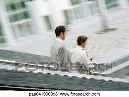 Two businessmen on stairs outside, blurred View Large Photo Image Stock Photo - Two businessmen on stairs outside, blurred. Fotosearch