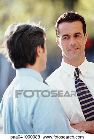 Two businessmen outside View Large Photo Image Stock Photo - Two businessmen outside. Fotosearch