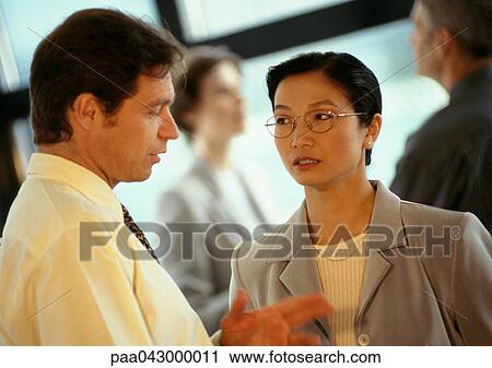 Businesspeople talking, close-up View Large Photo Image Stock Image - Businesspeople talking, close-up. Fotosearch