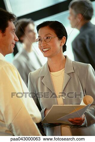 Businesspeople talking View Large Photo Image Stock Image - Businesspeople talking. Fotosearch